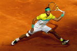 MADRID, SPAIN - MAY 16:  Rafael Nadal of Spain stretches to play a forehand against Novak Djokovic of Serbia in their semi-final during the Madrid Open tennis tournament at the Caja Magica on May 16, 2009 in Madrid, Spain.  (Photo by Clive Brunskill/Getty Images)