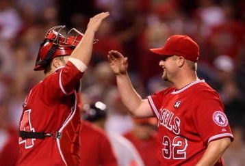 ANAHEIM, CA - MAY 13:  Pitcher Matt Palmer #32 of the Los Angeles Angels of Anaheim is congratulated by catcher Mike Napoli #44 after picking up his first major league complete game victory, against the Boston Red Sox on May 13, 2009 at Angel Stadium in Anaheim, California.  The Angels won 8-4.  (Photo by Stephen Dunn/Getty Images)