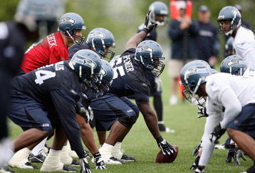 RENTON, WA - MAY 2:  Center Chris Spencer #65 prepares to snap the ball to Matt Hasselbeck #8 of the Seattle Seahawks during minicamp at the Seahawks training facility on May 2, 2009 in Renton, Washington. (Photo by Otto Greule Jr/Getty Images) 