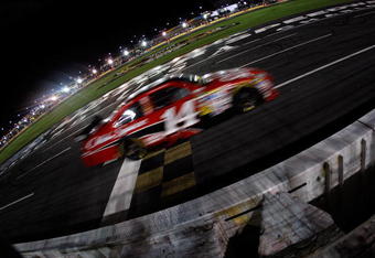 CONCORD, NC - MAY 16:  Tony Stewart, driver of the #14 Office Depot Chevrolet, crosses the finish line to win the NASCAR Sprint All-Star Race on May 16, 2009 at Lowe's Motor Speedway in Concord, North Carolina.  (Photo by Chris Graythen/Getty Images)