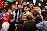 LAS VEGAS - MAY 02: (M) Manny Pacquiao of the Philippines celebrates after knocking out Ricky Hatton of England in the second round during their junior welterweight title fight at the MGM Grand Garden Arena May 2, 2009 in Las Vegas, Nevada. (Photo by Ethan Miller/Getty Images)