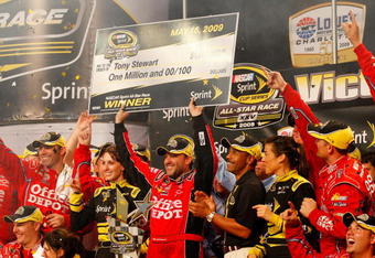 CONCORD, NC - MAY 16:  Tony Stewart, driver of the #14 Office Depot Chevrolet, celebrates in victory lane after winning the NASCAR Sprint All-Star Race on May 16, 2009 at Lowe's Motor Speedway in Concord, North Carolina.  (Photo by Geoff Burke/Getty Images for NASCAR)