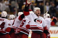 BOSTON - MAY 14: Joe Corvo #77 of the Carolina Hurricanes celebrates the win in Game Seven of the Eastern Conference Semifinal Round of the 2009 Stanley Cup Playoffs on May 14, 2009 at the TD Banknorth Garden in Boston, Massachusetts. The Hurricanes defeated the Bruins 3-2 in overtime. (Photo by Elsa/Getty Images)