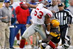 PITTSBURGH - OCTOBER 26: Bryan Kehl #53 of the New York Giants is tackled by Gary Russell #33 of the Pittsburgh Steelers after Kehl intercepted a pass on October 26, 2008 at Heinz Field in Pittsburgh, Pennsylvania. Russell was called for a horsecollar penalty on the play. (Photo by Rick Stewart/Getty Images)