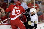 DETROIT - JUNE 02: Darren Helm #43 of the Detroit Red Wings hits Rob Scuderi #4 of the Pittsburgh Penguins during game five of the 2008 NHL Stanley Cup Finals at Joe Louis Arena on June 2, 2008 in Detroit, Michigan. The Penguins defeated the Red Wings 4-3 in triple overtime to set the series at 3-2 Red Wings. (Photo by Jim McIsaac/Getty Images) 
