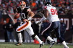 CLEVELAND - NOVEMBER 23: Brady Quinn #10 of the Cleveland Browns looks to throw the ball while defended by Mario Williams #90 of the Houston Texans during the NFL game at Cleveland Browns Stadium on November 23, 2008 in Cleveland, Ohio.  (Photo by Andy Lyons/Getty Images)