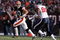 CLEVELAND - NOVEMBER 23: Brady Quinn #10 of the Cleveland Browns looks to throw the ball while defended by Mario Williams #90 of the Houston Texans during the NFL game at Cleveland Browns Stadium on November 23, 2008 in Cleveland, Ohio.  (Photo by Andy Lyons/Getty Images)