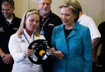 INDIANAPOLIS, IN- MAY 06:  Democratic presidential hopeful U.S. Senator Hillary Clinton (D-NY) (R) looks on as race car driver Sarah Fisher shows her the steering wheel of her Indy race car as she visits the Indianapolis Motor Speedway on primary day May 6, 2008 in Indianapolis, Indiana. Sen. Barack Obama, (D-IL) and Senator Hillary Clinton (D-NY) hope to win the state on May 6 as the Democrats battle for their parties' presidential nomination.  (Photo by Joe Raedle/Getty Images)