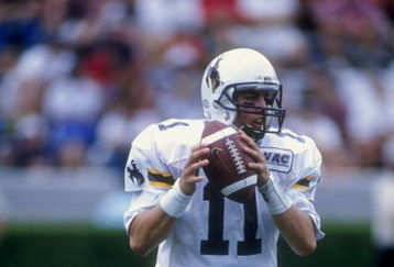 19 Sep 1998:  Quarterback Jay Stoner #11 of the Wyoming Cowboys drops back to pass during a game against the Georgia Bulldogs at the Sanford Stadium in Athens, Georgia. The Bulldogs defeated the Cowboys 16-9.