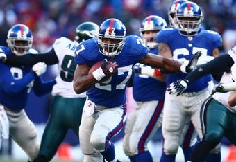 EAST RUTHERFORD, NJ -  JANUARY 11:  Brandon Jacobs #27 of the New York Giants runs the ball against the Philadelphia Eagles during the NFC Divisional Playoff Game on January 11, 2009 at Giants Stadium in East Rutherford, New Jersey.  The Eagles defeated the Giants 23 -11. (Photo by Chris McGrath/Getty Images)