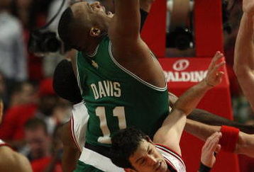 CHICAGO - APRIL 30: Glen Davis #11 of the Boston Celtics grabs a rebound over Kirk Hinrich #12 of the Chicago Bulls in Game Six of the Eastern Conference Quarterfinals during the 2009 NBA Playoffs at the United Center on April 30, 2009 in Chicago, Illinois. The Bulls defeated the Celtics 128-127 in triple-overtime. NOTE TO USER: User expressly acknowledges and agreees that, by downloading and/or using this Photograph, User is consenting to the terms and conditions of the Getty Images License Agreement. (Photo by Jonathan Daniel/Getty Images)