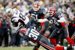 ORCHARD PARK, NY - DECEMBER 28: Wes Welker #83 of the New England Patriots falls forward for a first down ahead of Ko Simpson #30, Paul Posluszny #51 and Terrence McGee #24 of the Buffalo Bills at Ralph Wilson Stadium December 28, 2008 in Orchard Park, New York.  (Photo by Rick Stewart/Getty Images)