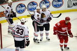 DETROIT - MAY 17:  Dave Bolland #36, Dustin Byfuglien #33, Kris Versteeg #32 and Patrick Kane #88 of the Chicago Blackhawks celebrate after Versteeg scored a power play goal in the third period against the Detroit Red Wings during Game One of the Western Conference Championship Round of the 2009 Stanley Cup Playoffs on May 17, 2009 at Joe Louis Arena in Detroit, Michigan.  (Photo by Claus Andersen/Getty Images)