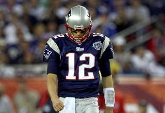 GLENDALE, AZ - FEBRUARY 03:  Quarterback Tom Brady #12 of the New England Patriots walks off the field in the second half of Super Bowl XLII against the New York Giants on February 3, 2008 at the University of Phoenix Stadium in Glendale, Arizona.  The Giants defeated the Patriots 17-14. (Photo by Donald Miralle/Getty Images)