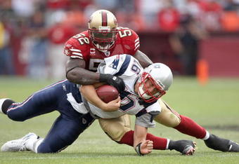 SAN FRANCISCO - OCTOBER 5:  Quarterback Matt Cassel #16 of the New England Patriots is sacked by Patrick Willis #52 of the San Francisco 49ers during an NFL game on October 5, 2008 at Monster Park in San Francisco, California. 