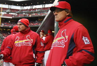ST. LOUIS - APRIL 06:  Manager Tony LaRussa #10 of the St. Louis Cardinals looks on from the dugout against the Pittsburgh Pirates during Opening Day on April 6, 2009  at Busch Stadium in St. Louis, Missouri. The Pittsburgh Pirates defeated the St. Louis Cardinals 6-4.  (Photo by Elsa/Getty Images)
