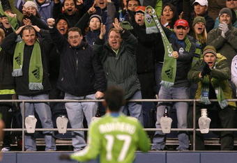 SEATTLE - MARCH 28:  Seattle Sounders FC forward Fredy Montero #17 celebrates with fans after scoring the second goal against Real Salt Lake on March 28, 2009 at Qwest Field in Seattle, Washington. The Sounders defeated Real Salt Lake 2-0. (Photo by Otto Greule Jr/Getty Images)