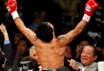 LAS VEGAS - MAY 02:  Manny Pacquiao of the Philippines celebrates with promoter Bob Arum after defeating Ricky Hatton of England in the second round of their junior welterweight title fight at the MGM Grand Garden Arena May 2, 2009 in Las Vegas, Nevada.  (Photo by Ethan Miller/Getty Images)