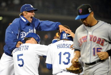 LOS ANGELES, CA - MAY 18:  Clayton Kershaw #22 of the Los Angeles Dodgers celebrates an Orlando Hudson at bat resulting in a fielder's choice and error to score Mark Loretta #5 with the bases loaded in the 11th inning in front of Carlos Beltran #15 of the New York Mets at Dodger Stadium on May 18, 2009 in Los Angeles, California.  (Photo by Harry How/Getty Images)