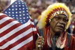 A Washington Redskins fan holds an American Flag on ESPN Monday Night Football September 11, 2006 in Washington.  The Minnesota  Vikings defeated the Redskins  19 - 16.  (Photo by Al Messerschmidt/Getty Images)