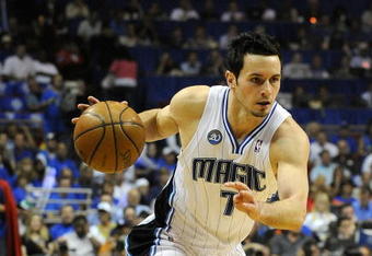 ORLANDO, FL - MAY 14:  JJ Redick #7 of the Orlando Magic looks to drive against the Boston Celtics in Game Six of the Eastern Conference Semifinals during the 2009 NBA Playoffs at Amway Arena on May 14, 2009 in Orlando, Florida.  NOTE TO USER: User expressly acknowledges and agrees that, by downloading and/or using this Photograph, user is consenting to the terms and conditions of the Getty Images License Agreement.  (Photo by Sam Greenwood/Getty Images)