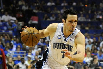 ORLANDO, FL - MAY 14:  JJ Redick #7 of the Orlando Magic looks to drive against the Boston Celtics in Game Six of the Eastern Conference Semifinals during the 2009 NBA Playoffs at Amway Arena on May 14, 2009 in Orlando, Florida.  NOTE TO USER: User expressly acknowledges and agrees that, by downloading and/or using this Photograph, user is consenting to the terms and conditions of the Getty Images License Agreement.  (Photo by Sam Greenwood/Getty Images)