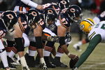 CHICAGO - DECEMBER 22: Members of the Chicago Bear offensive line including Olin Kreutz #57, Roberto Garza #63 and John Tait #76 line-up in front of the Green Bay Packer defense on December 22, 2008 at Soldier Field in Chicago, Illinois. The Bears defeated the Packers 20-17 in overtime. (Photo by Jonathan Daniel/Getty Images)