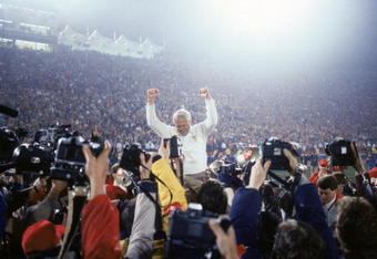 STANFORD, CA - JANUARY 20:  Head coach Bill Walsh of the San Francisco 49ers enjoys a victory ride on the field after defeating the Miami Dolphins 38-16 in Super Bowl XIX at Stanford Stadium on January 20, 1985 in Stanford, California.  (Photo by George Rose/Getty Images)