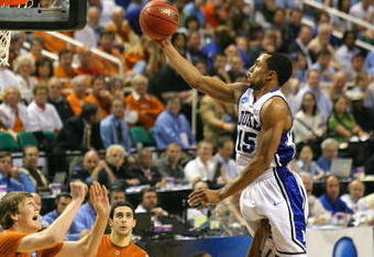 GREENSBORO, NC - MARCH 21:  Gerald Henderson #15 of the Duke Blue Devils lays in a basket against A.J. Abrams #3 and Clint Chapman #53 of the Texas Longhorns during the second round of the NCAA Division I Men's Basketball Tournament at the Greensboro Coliseum on March 21, 2009 in Greensboro, North Carolina.  (Photo by Streeter Lecka/Getty Images)