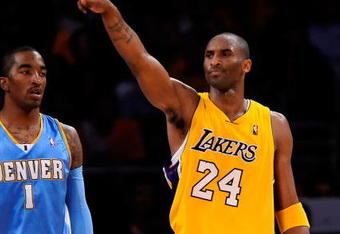 LOS ANGELES, CA - MAY 19:  Kobe Bryant #24 of the Los Angeles Lakers points as he stands with J.R. Smith #1 of the Denver Nuggets in the second half of Game One of the Western Conference Finals during the 2009 NBA Playoffs at Staples Center on May 19, 2009 in Los Angeles, California. NOTE TO USER: User expressly acknowledges and agrees that, by downloading and or using this photograph, User is consenting to the terms and conditions of the Getty Images License Agreement.  (Photo by Kevork Djansezian/Getty Images)