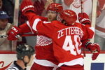 DETROIT - MAY 19:  Dan Cleary #11 and Henrik Zetterberg #40 of the Detroit Red Wings celebrate after Cleary scored a goal in the second period against the Chicago Blackhawks during Game Two of the Western Conference Championship Round of the 2009 Stanley Cup Playoffs on May 19, 2009 at Joe Louis Arena in Detroit, Michigan.  (Photo by Claus Andersen/Getty Images)