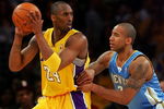 LOS ANGELES, CA - MAY 19:  Kobe Bryant #24 of the Los Angeles Lakers posts up Dahntay Jones #30 of the Denver Nuggets in the first half of Game One of the Western Conference Finals during the 2009 NBA Playoffs at Staples Center on May 19, 2009 in Los Angeles, California. NOTE TO USER: User expressly acknowledges and agrees that, by downloading and or using this photograph, User is consenting to the terms and conditions of the Getty Images License Agreement.  (Photo by Stephen Dunn/Getty Images)