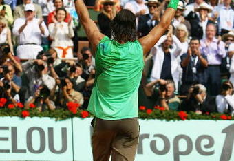 PARIS - JUNE 08:  Rafael Nadal of Spain waves to the fans following his victory during the Men's Singles Final match against Roger Federer of Switzerland on day fifteen of the French Open at Roland Garros on June 8, 2008 in Paris, France.  (Photo by Julian Finney/Getty Images)