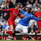 GLASGOW, SCOTLAND - MAY 16: Maurice Edu of Rangers is tackled by Mark Kerr of Aberdeen during the Scottish Premier League match between Rangers and Aberdeen at Ibrox Stadium on May 16, 2009 in Glasgow, Scotland.  (Photo by Jeff J Mitchell/Getty Images)