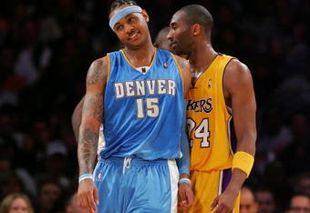 LOS ANGELES - APRIL 3:  Carmello Anthony #15 (L) of the Denver Nuggets and Kobe Bryant #24 of the Los Angeles Lakers joke around during the game at Staples Center April 3, 2007 in Los Angeles, California.  NOTE TO USER: User expressly acknowledges and agrees that, by downloading and/or using this Photograph, user is consenting to the terms and conditions of the Getty Images License Agreement.  (Photo by Lisa Blumenfeld/Getty Images)