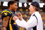 CHARLOTTE, NC - DECEMBER 27:  Head coach Bill Stewart of the West Virginia Mountaineers celebrates with his quarterback Pat White #5 after their 31-30 victory over the North Carolina Tar Heels at Bank of America Stadium on December 27, 2008 in Charlotte, North Carolina.  (Photo by Streeter Lecka/Getty Images)