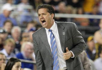 GLENDALE, AZ - MARCH 26:  Head Coach John Calipari of the Memphis Tigers adjusts his team against the Missouri Tigers in the Sweet 16 of the NCAA Division I Men's Basketball Tournament at the University of Phoenix Stadium on March 26, 2009 in Glendale, Arizona.  (Photo by Ronald Martinez/Getty Images)