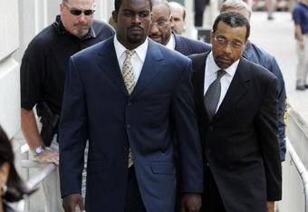 RICHMOND, VA - AUGUST 27:  Atlanta Falcons quarterback Michael Vick (R) arrives at federal court with attorney Billy Martin (R) August 27, 2007 in Richmond, Viriginia. Vick pleaded guilty to a federal dogfighting charge.  (Photo by Steve Helber-Pool/Getty Images)