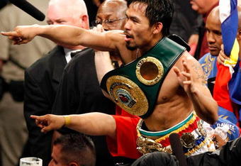 LAS VEGAS - MAY 02:  Manny Pacquiao of the Philippines celebrates after knocking out Ricky Hatton of England in the second round of their junior welterweight title fight at the MGM Grand Garden Arena May 2, 2009 in Las Vegas, Nevada.  (Photo by Ethan Miller/Getty Images)