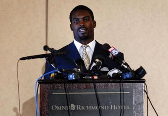 RICHMOND, VA - AUGUST 27:  Atlanta Falcons quarterback Michael Vick speaks to reporters at the Omni Richmond Hotel after agreeing to a guilty plea on charges stemming from his involvement in a dogfighting ring August 27, 2007, in Richmond, Virginia.  (Photo by Jonathan Ernst/Getty Images)