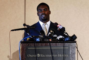 RICHMOND, VA - AUGUST 27:  Atlanta Falcons quarterback Michael Vick speaks to reporters at the Omni Richmond Hotel after agreeing to a guilty plea on charges stemming from his involvement in a dogfighting ring August 27, 2007, in Richmond, Virginia.  (Photo by Jonathan Ernst/Getty Images)