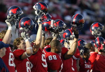 DALLAS - NOVEMBER 29:  Members of the Southern Methodist University Mustangs cheer the start of the second half against the Texas Christian University Horned Frogs despite looking at an 0-11 season November 29, 2003 at Gerald J. Ford Stadium in Dallas, Texas.  TCU won 20-13.  (Photo by Brian Bahr/Getty Images)