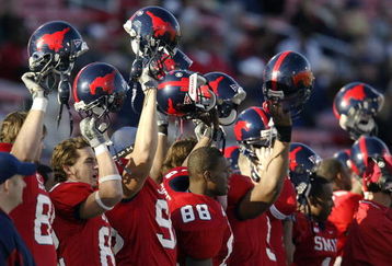 DALLAS - NOVEMBER 29:  Members of the Southern Methodist University Mustangs cheer the start of the second half against the Texas Christian University Horned Frogs despite looking at an 0-11 season November 29, 2003 at Gerald J. Ford Stadium in Dallas, Texas.  TCU won 20-13.  (Photo by Brian Bahr/Getty Images)