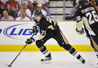 PITTSBURGH - MAY 08:  Forward Evgeni Malkin #71 of the Pittsburgh Penguins skates with the puck against the Washington Capitals during Game Four of the Eastern Conference Semifinal Round of the 2009 Stanley Cup Playoffs at Mellon Arena on May 8, 2009 in Pittsburgh, Pennsylvania.  (Photo by Jamie Sabau/Getty Images)