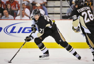 PITTSBURGH - MAY 08:  Forward Evgeni Malkin #71 of the Pittsburgh Penguins skates with the puck against the Washington Capitals during Game Four of the Eastern Conference Semifinal Round of the 2009 Stanley Cup Playoffs at Mellon Arena on May 8, 2009 in Pittsburgh, Pennsylvania.  (Photo by Jamie Sabau/Getty Images)