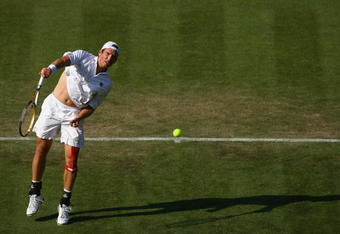 LONDON - SEPTEMBER 19:  Alexander Peya of Austria in action against Andy Murray of Great Britain during day one of the Davis Cup World Group Playoff tie between Great Britain and Austria at Wimbledon, the AELTC on September 19, 2008 in Wimbledon, England.  (Photo by Julian Finney/Getty Images)
