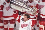 Defenseman Vladimir Konstantinov of the Detroit Red Wings celebrates with the Stanley Cup after a championship game against the Philadelphia Flyers at Joe Louis Arena in Detroit, Michigan. The Red Wings won the game, 2-1.