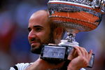6 Jun 1999: Andre Agassi of the USA holds up the trophy after defeating Andrei Medvedev of the Ukraine to win the men's singles final of the French Open at Roland Garros in Paris, France.