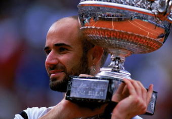 6 Jun 1999: Andre Agassi of the USA holds up the trophy after defeating Andrei Medvedev of the Ukraine to win the men's singles final of the French Open at Roland Garros in Paris, France.