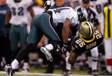 NEW ORLEANS - JANUARY 13:  Sheldon Brown #24 of the Philadelphia Eagles breaks up a pass intended for Reggie Bush #25 of the New Orleans Saints during the NFC divisional playoff game at the Superdome on January 13, 2007 in New Orleans, Louisiana.  (Photo by Ronald Martinez/Getty Images)